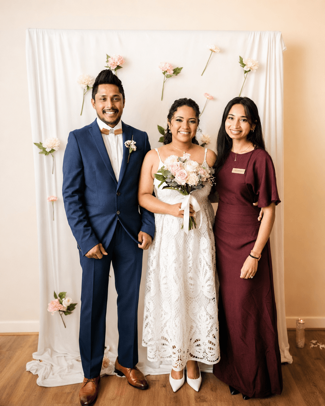 Rushmi Kumar with a newlywed bride and groom after their Melbourne wedding ceremony